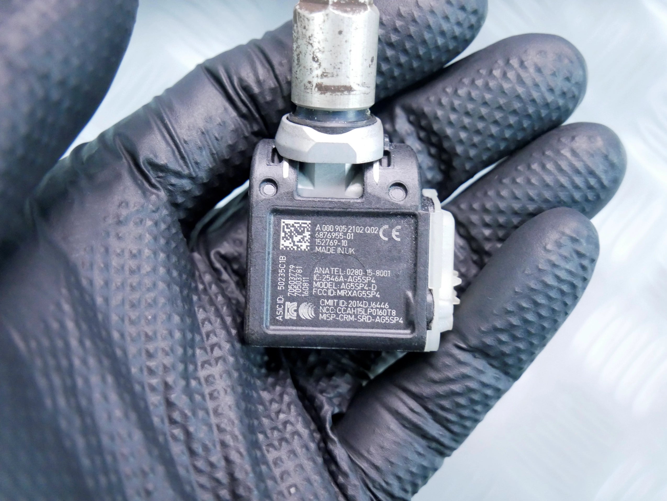 Czujnik TPMS ciśnienia opon kół OEM A0009052102 Mercedes E220D W213